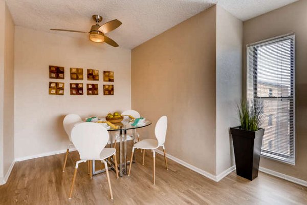 Dining room with modern decor and elegant lighting in Lakeview Towers at Belmar Apartments, luxury living