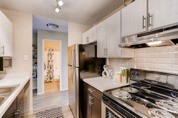 Modern kitchen with stainless steel appliances at Lakeview Towers at Belmar Apartments