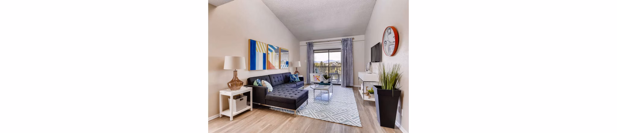 Spacious living room with modern decor at Lakeview Towers, a luxury apartment at Belmar