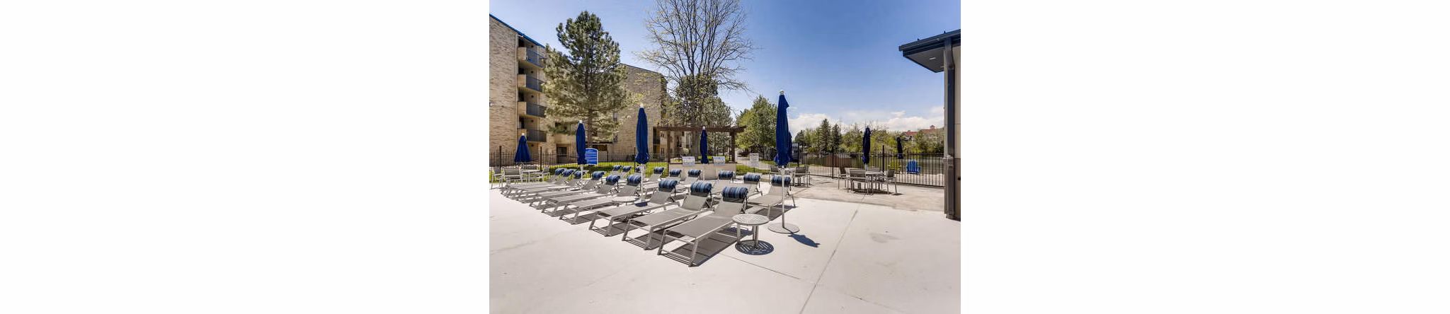Spacious patio with modern furniture at Lakeview Towers at Belmar Apartments offering outdoor relaxation