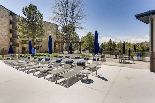Spacious patio with modern furniture at Lakeview Towers at Belmar Apartments offering outdoor relaxation