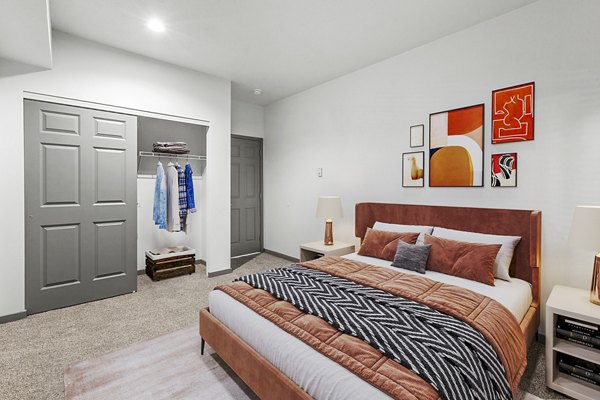 Cozy bedroom with modern decor at Big Trout Lodge Apartments