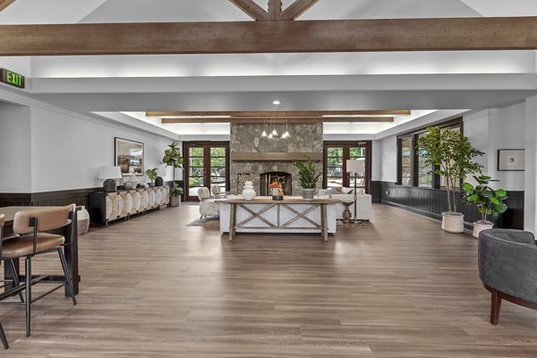 Clubhouse with cozy seating and a fireplace at Big Trout Lodge Apartments