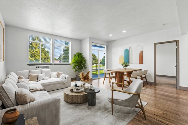 Big Trout Lodge Apartments: modern living room with cozy seating and large windows