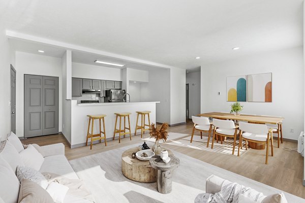 Cozy living room with stylish decor and large windows in Big Trout Lodge Apartments