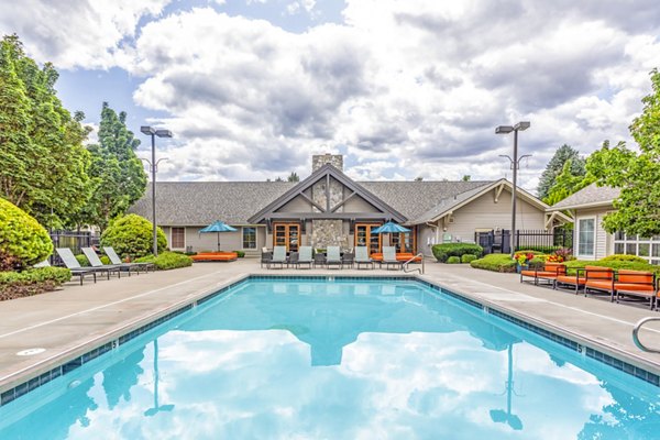 Outdoor pool with scenic views at Big Trout Lodge Apartments, a luxury living community