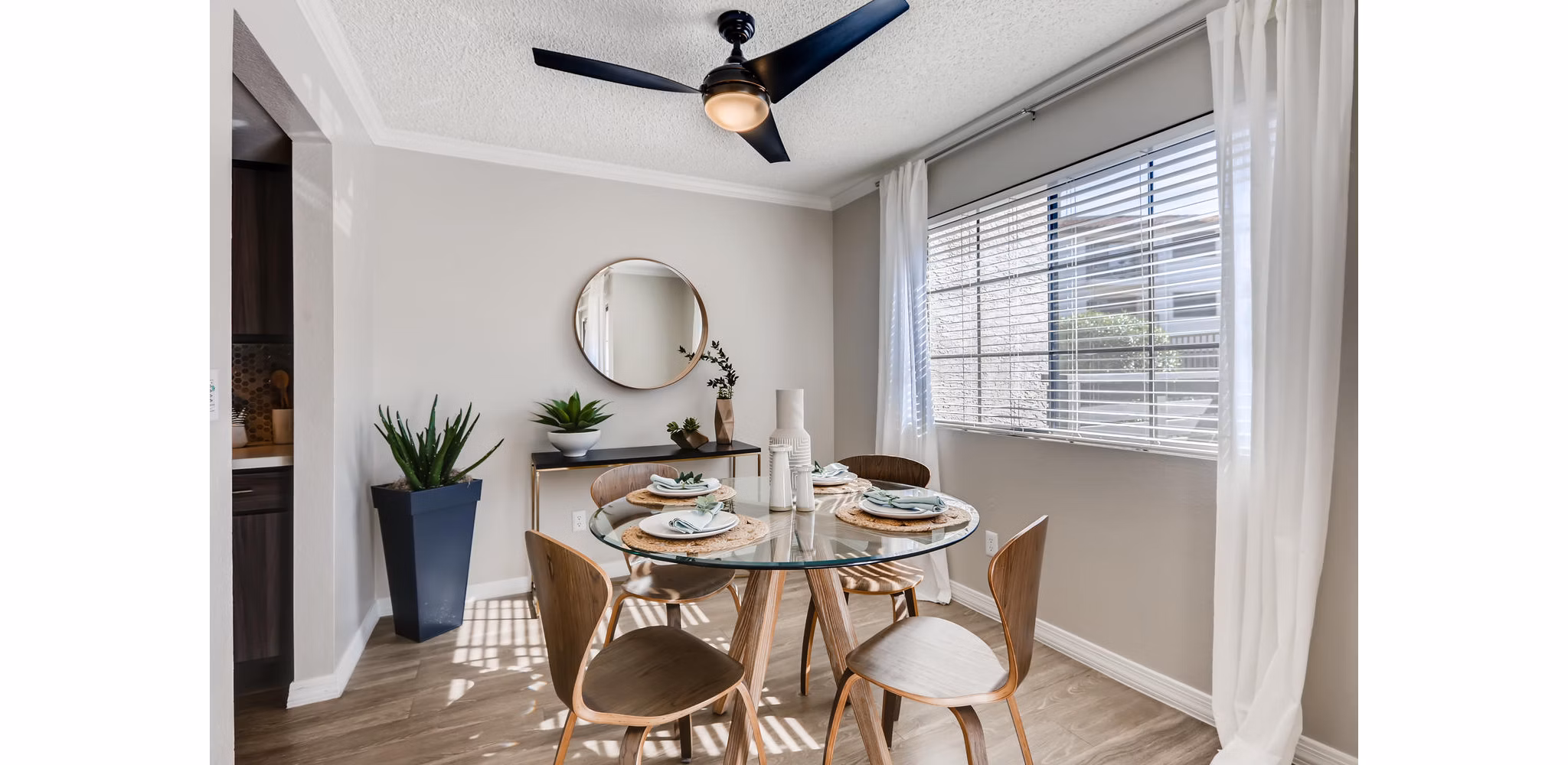Chazal Scottsdale Apartments: Elegant dining area with modern furnishings and tasteful lighting