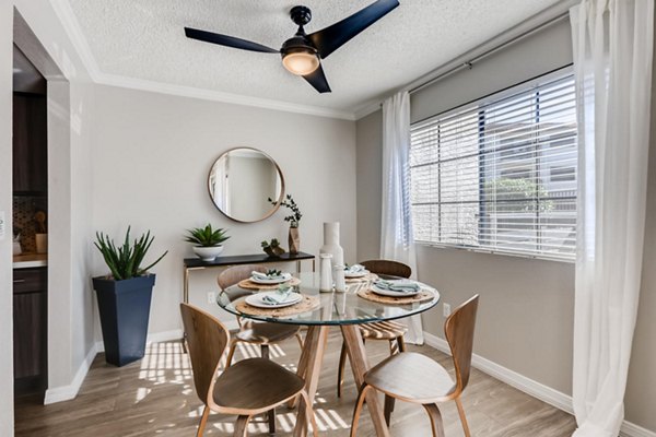 Chazal Scottsdale Apartments: Elegant dining area with modern furnishings and tasteful lighting