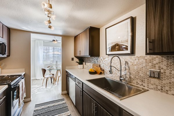 Modern kitchen with stainless steel appliances at Chazal Scottsdale Apartments, offering luxury living in Scottsdale
