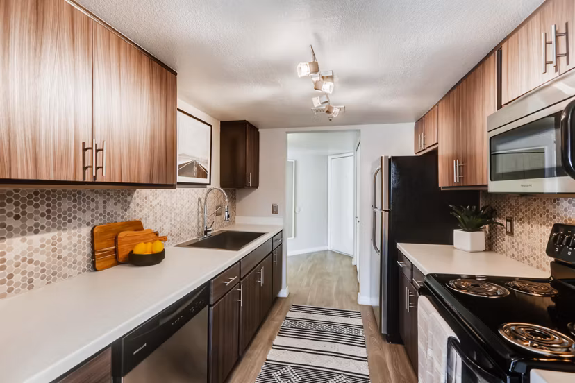 Modern kitchen with stainless steel appliances at Chazal Scottsdale Apartments