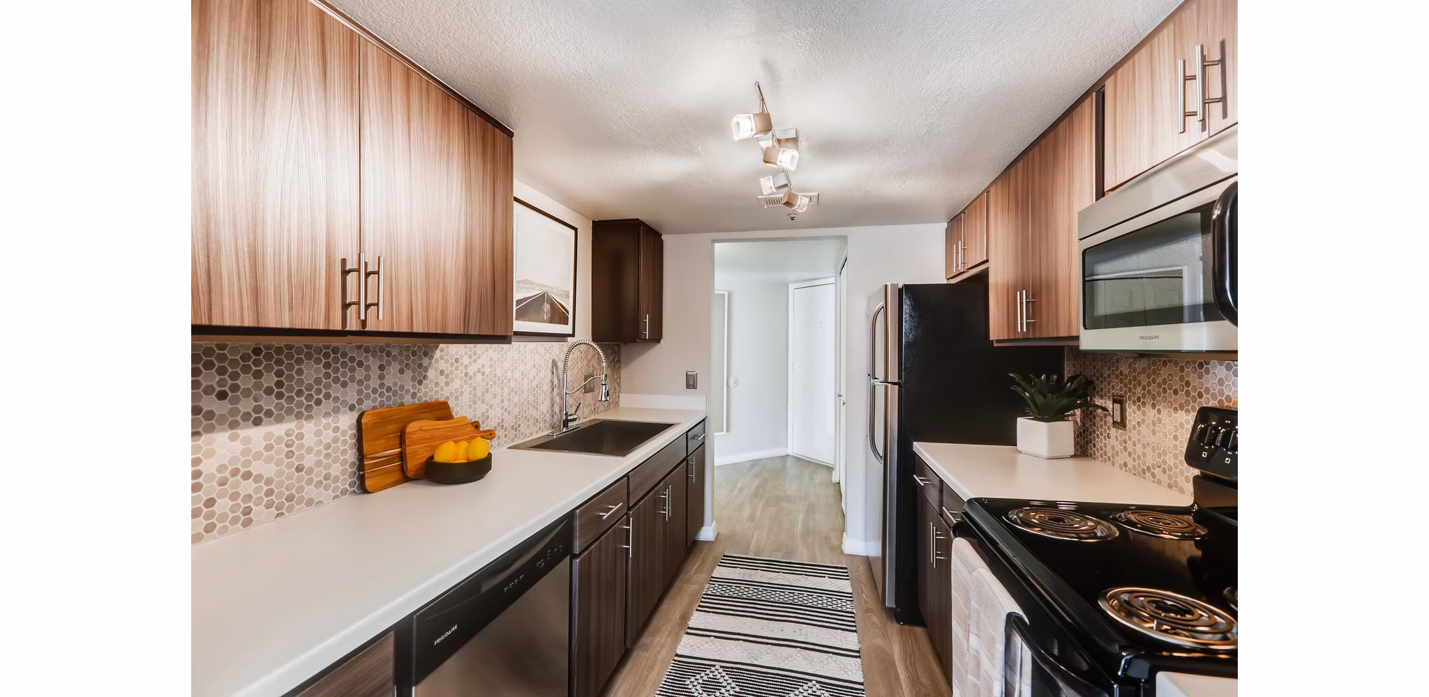 Modern kitchen with stainless steel appliances at Chazal Scottsdale Apartments