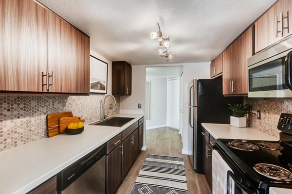 Modern kitchen with stainless steel appliances at Chazal Scottsdale Apartments