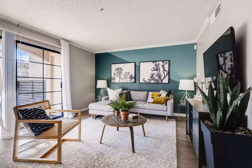 Spacious living room with modern decor and natural lighting at Chazal Scottsdale Apartments