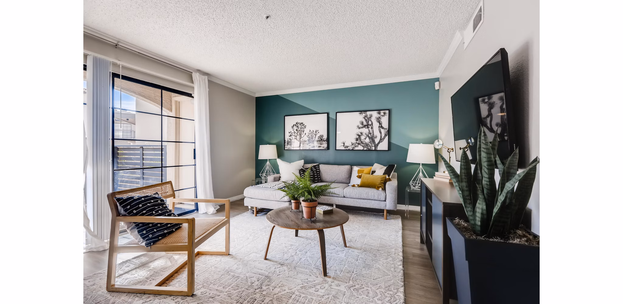 Spacious living room with modern decor and natural lighting at Chazal Scottsdale Apartments