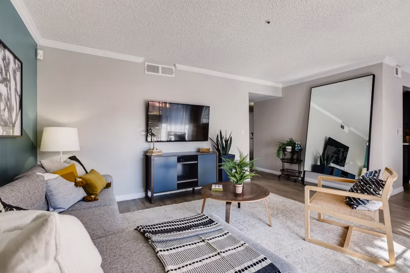 Spacious living room featuring modern decor and ample natural light in Chazal Scottsdale Apartments