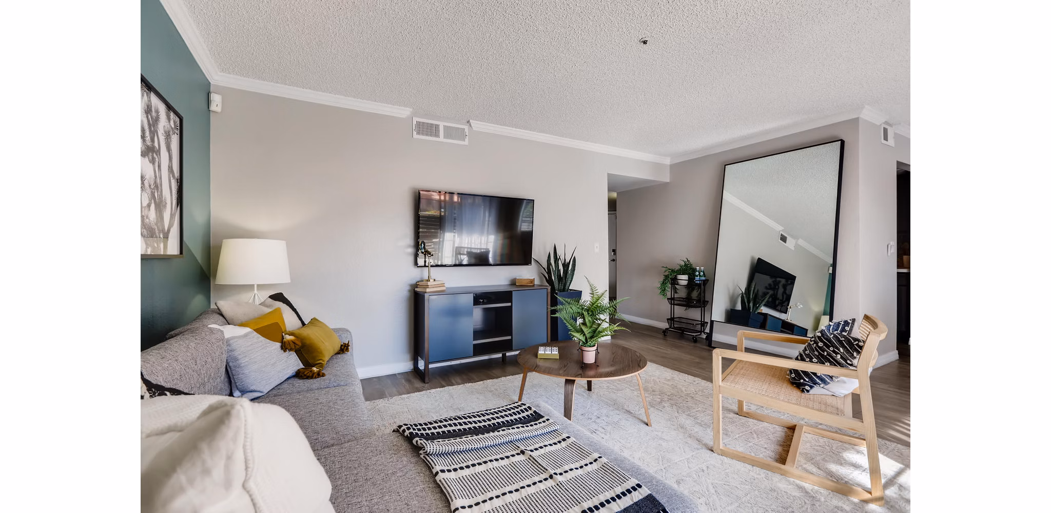 Spacious living room featuring modern decor and ample natural light in Chazal Scottsdale Apartments