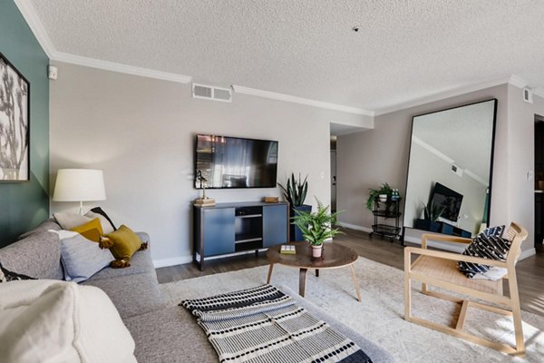 Spacious living room featuring modern decor and ample natural light in Chazal Scottsdale Apartments