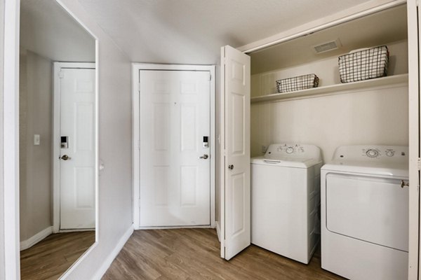 Laundry room with modern appliances at Chazal Scottsdale Apartments
