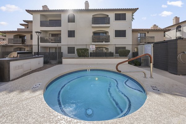 Resort-style pool with lounge seating at Chazal Scottsdale Apartments