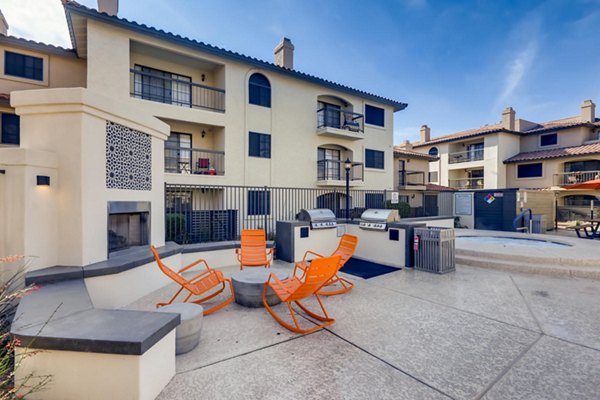 Outdoor grilling area with modern barbecue stations at Chazal Scottsdale Apartments