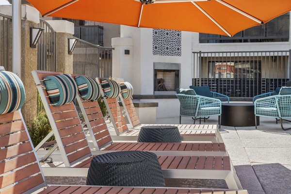 Chazal Scottsdale Apartments: Cozy patio with modern seating and lush landscaping perfect for relaxation