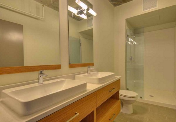 Modern bathroom with sleek fixtures in The Wilson Building Apartments