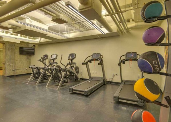 State-of-the-art fitness center at The Wilson Building Apartments, featuring modern equipment and spacious workout areas