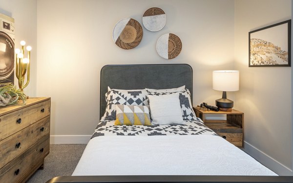 Stylish bedroom with mountain views at The Ridge at Mountain View Apartments