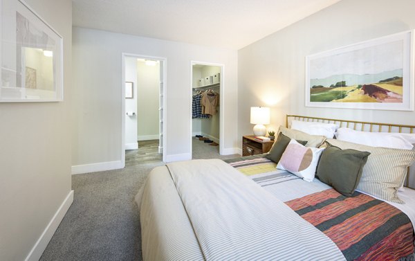 Cozy bedroom with mountain views at The Ridge at Mountain View Apartments
