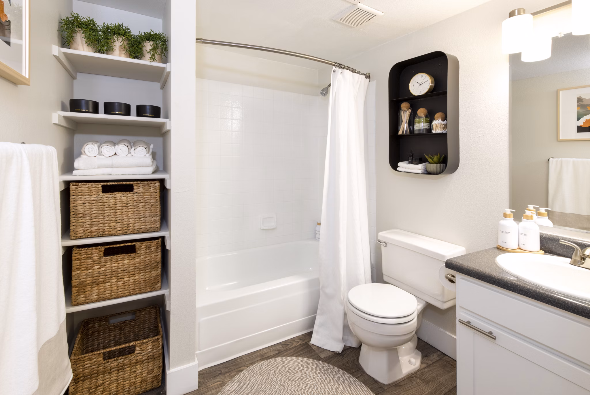 Modern bathroom with marble countertop at The Ridge at Mountain View Apartments