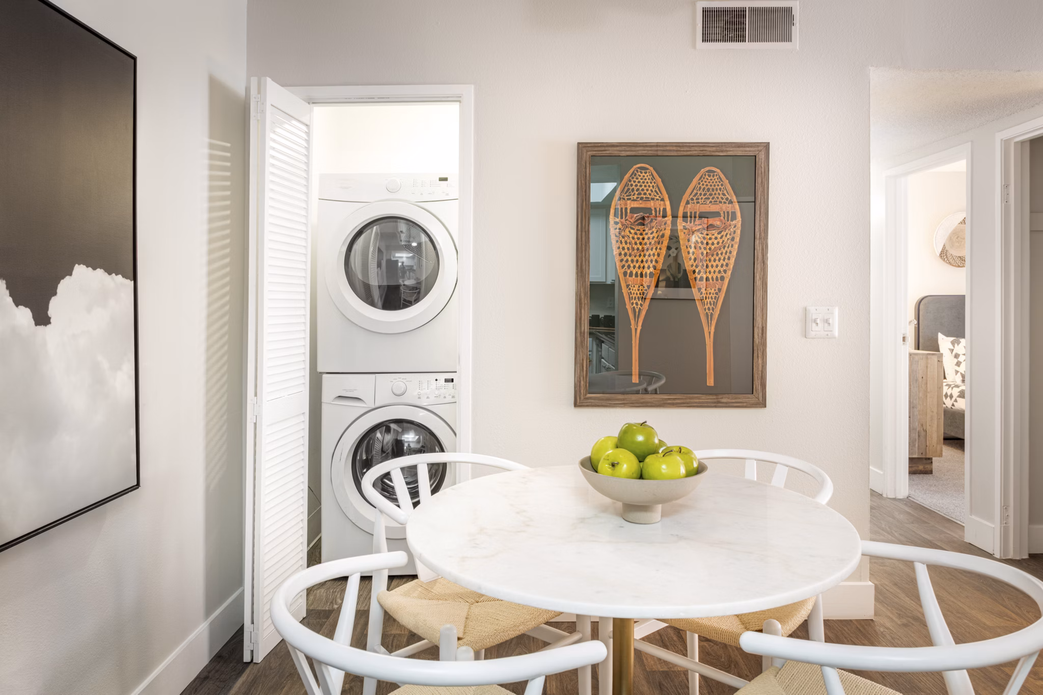 Dining area with stylish lighting and modern furniture at The Ridge at Mountain View Apartments