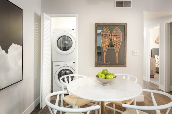 Dining area with stylish lighting and modern furniture at The Ridge at Mountain View Apartments