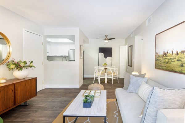Spacious living room with modern furnishings in The Ridge at Mountain View Apartments