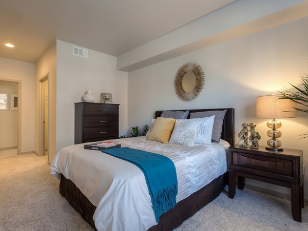 121 Tasman Apartments: Cozy bedroom with modern furnishings near Milpitas