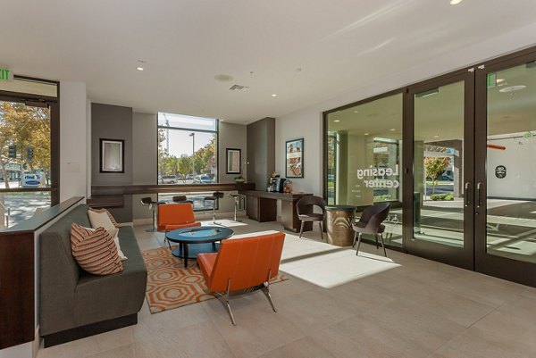 Clubhouse at 121 Tasman Apartments featuring modern design and comfortable seating areas for social gatherings