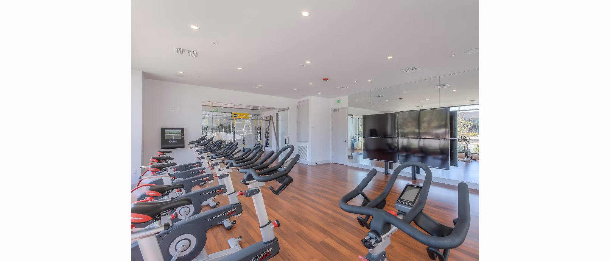 Modern fitness room with state-of-the-art equipment at 121 Tasman Apartments