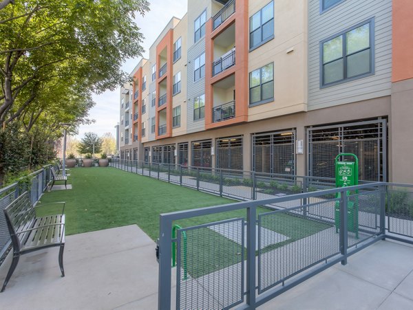 Dog park with agility equipment at 121 Tasman Apartments, a luxury  community