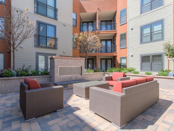 Recreational area with outdoor seating at 121 Tasman Apartments, luxury living ideal for leisure and relaxation