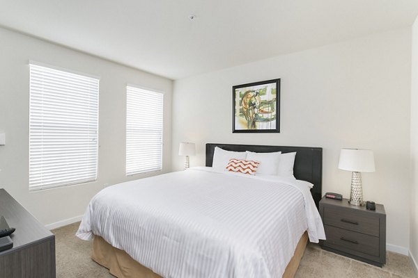 Spacious bedroom with modern decor at mResidences Redwood City Apartments