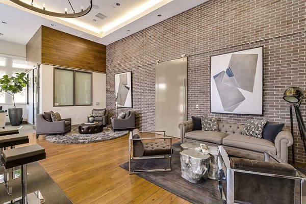 Clubhouse lobby with modern seating and stylish dÃ©cor at mResidences Redwood City Apartments