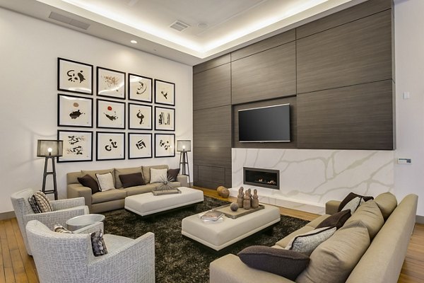 Modern clubhouse with stylish lobby at mResidences Redwood City Apartments featuring seating areas and contemporary decor