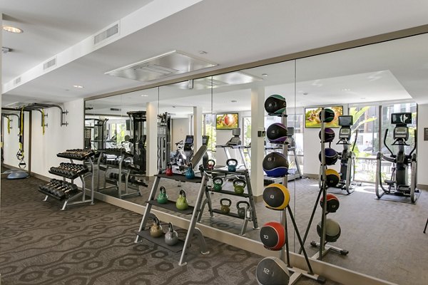 State-of-the-art fitness center with modern equipment at mResidences Redwood City Apartments