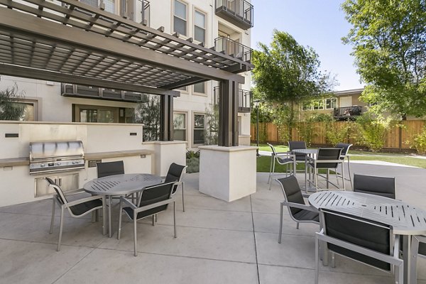 Grill and patio area at mResidences Redwood City Apartments for outdoor dining and relaxation