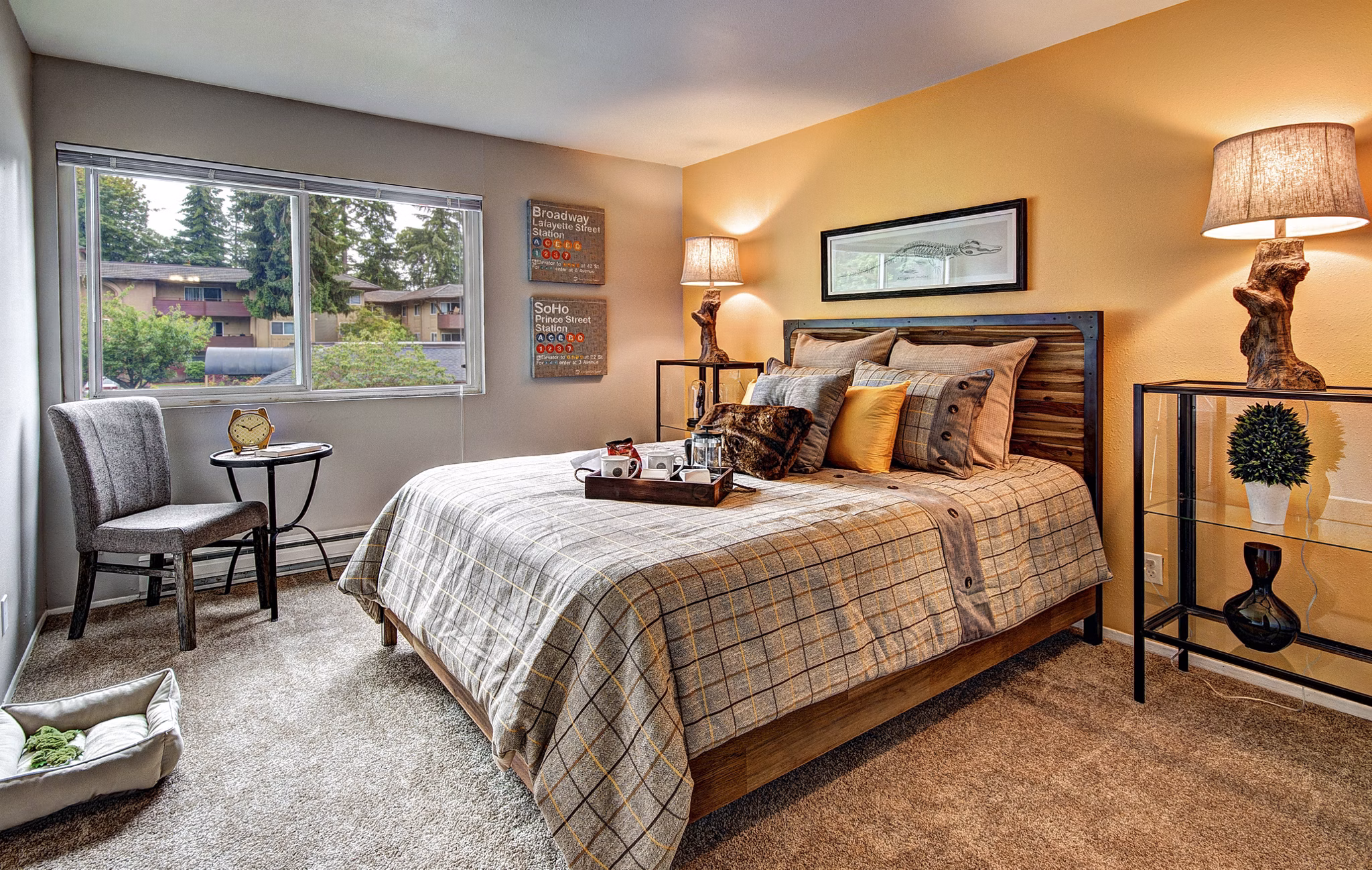 Cozy bedroom with modern decor at Central Park East Apartments