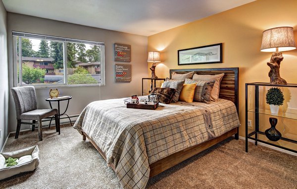 Cozy bedroom with modern decor at Central Park East Apartments