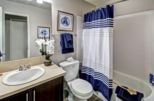 Bathroom featuring sleek design and modern fixtures at Central Park East Apartments