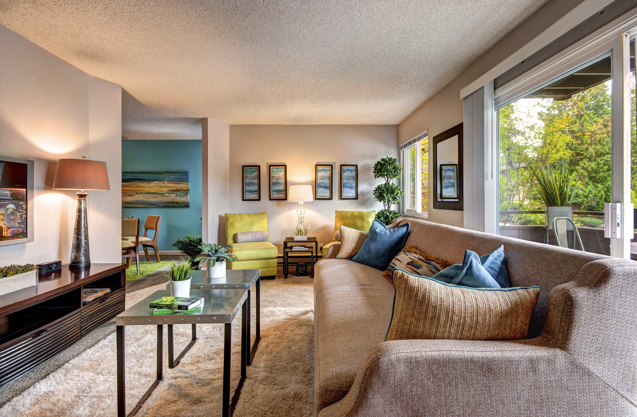 Spacious living room with modern decor in Central Park East Apartments