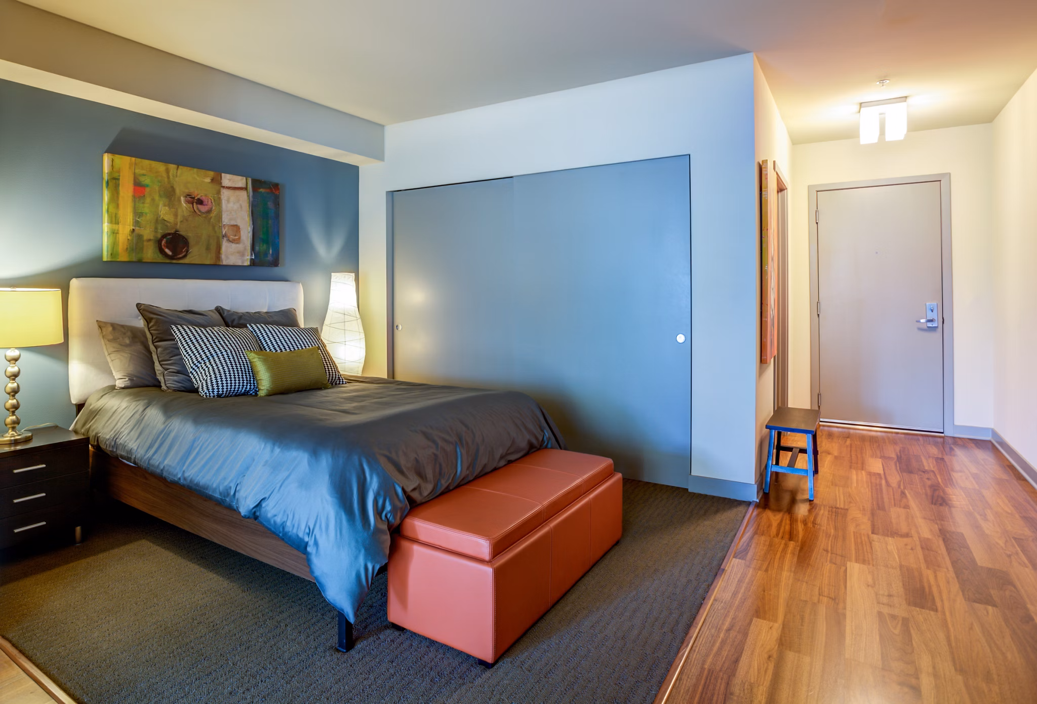 Bedroom interior featuring elegant decor and natural lighting at Equinox Apartments
