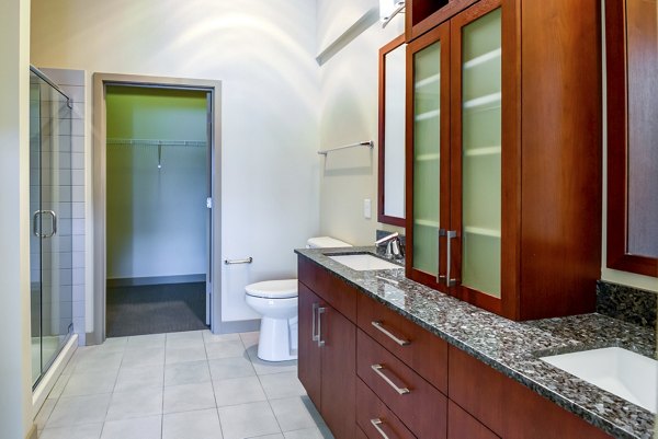 Bathroom featuring modern fixtures and elegant design at Equinox Apartments