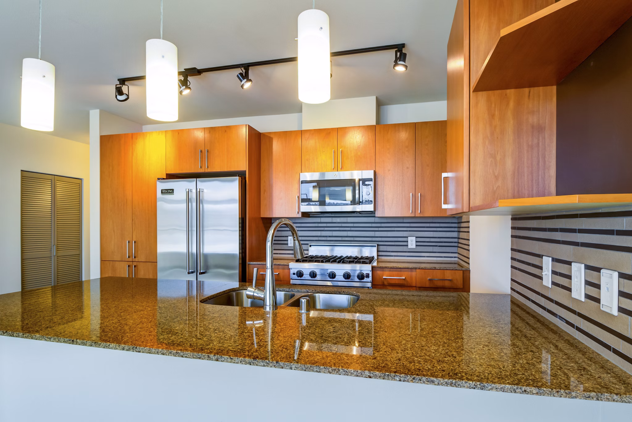 State-of-the-art fitness center with modern equipment at Equinox Apartments